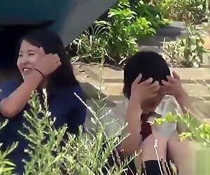 Teens peeing in field