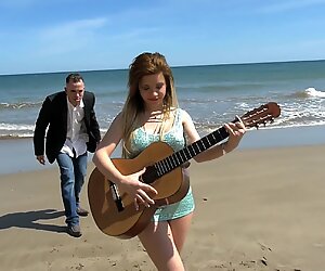 Outdoor threesome sex by the beach leaves the hot wife completely satisfied